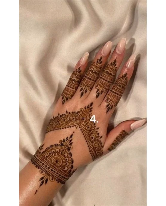 Teardrop Inspired Unique Back Hand Mehndi Design Teardrop Inspired Unique Back Hand Mehndi Design
